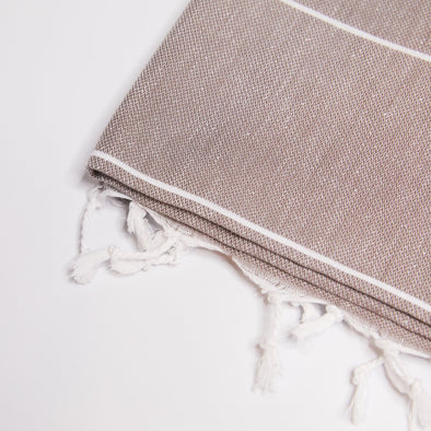 Sand Brown Turkish Towel - made from cotton and is lightweight and absorbent. Also available: cotton beach towels, chemical-free kid's toys, bags made from renewable materials and glass bottles. Natural, eco-friendly products for summer fun!